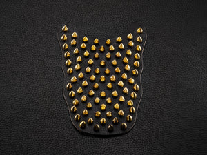 Black sneaker overlay with gold spikes for custom shoe styling.